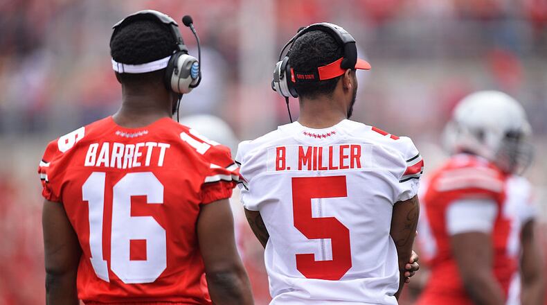COLUMBUS, OH - APRIL 18: Quarterbacks J.T. Barrett #16 of the Ohio State Buckeyes and Braxton Miller #5 of the Ohio State Buckeyes who are both injured watch their teammates during the annual Ohio State Spring Game at Ohio Stadium on April 18, 2015 in Columbus, Ohio. (Photo by Jamie Sabau/Getty Images)