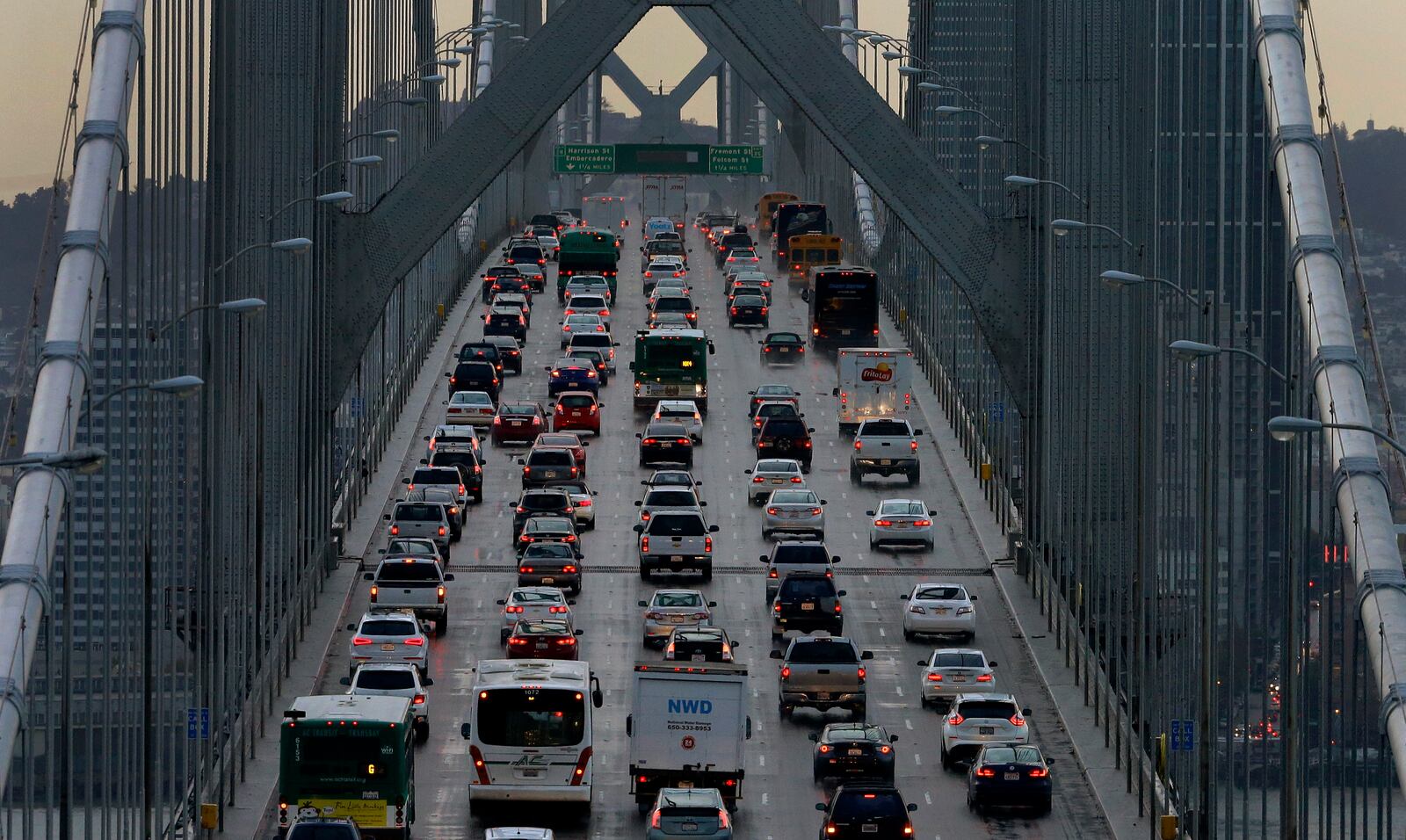 FILE - In this Dec. 10, 2015, file photo, vehicles make their way westbound on Interstate 80 across the San Francisco-Oakland Bay Bridge as seen from Treasure Island in San Francisco. (AP Photo/Ben Margot, File)