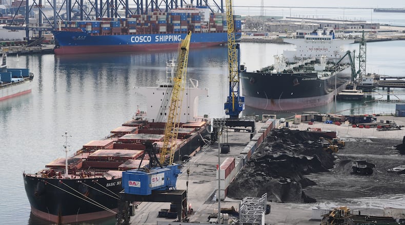 Ships are docked at the Port of Long Beach Friday, Feb. 20, 2026, in Long Beach, Calif. (AP Photo/Damian Dovarganes)
