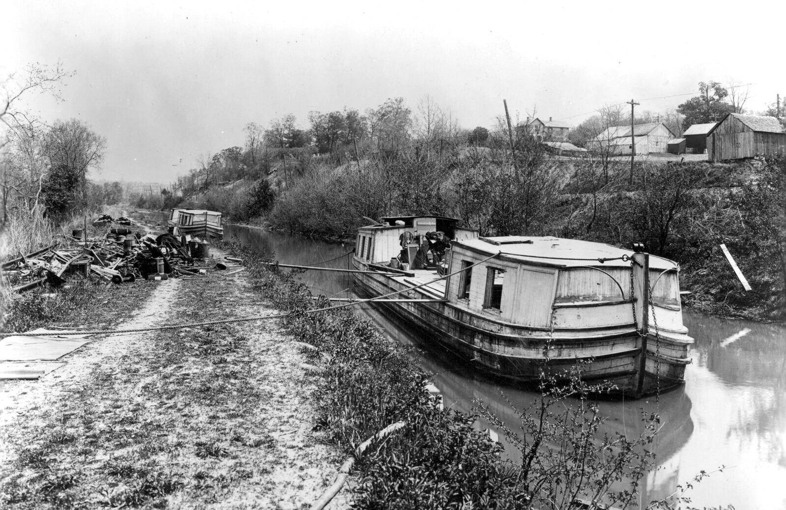 Two canal boats travel north on the Miami and Erie Canal north of Miamisburg. DAYTON METRO LIBRARY / MONTGOMERY COUNTY PICTURE FILE