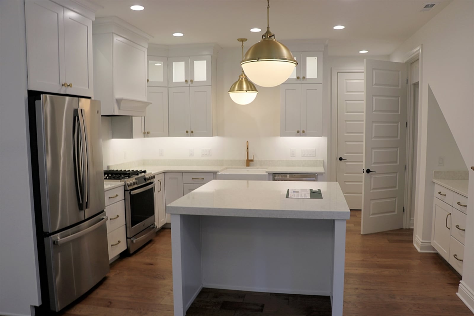 A large island is centered within the kitchen and has an extended counter to seat two. CONTRIBUTED BY KATHY TYLER