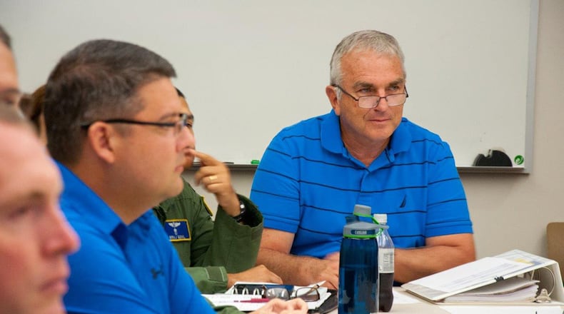 Aeromedical Consultation Service Deputy Chief Dr. Daniel Van Syoc listens during one of four weekly case review sessions in order to determine whether or not a waiver should be recommended for an aviator’s disqualifying medical condition. The ACS reviews approximately 2,000 cases a year with an 88 percent determination of recommendation for waivers, keeping Air Force pilots safely flying. (U.S. Air Force photo/John Harrington)