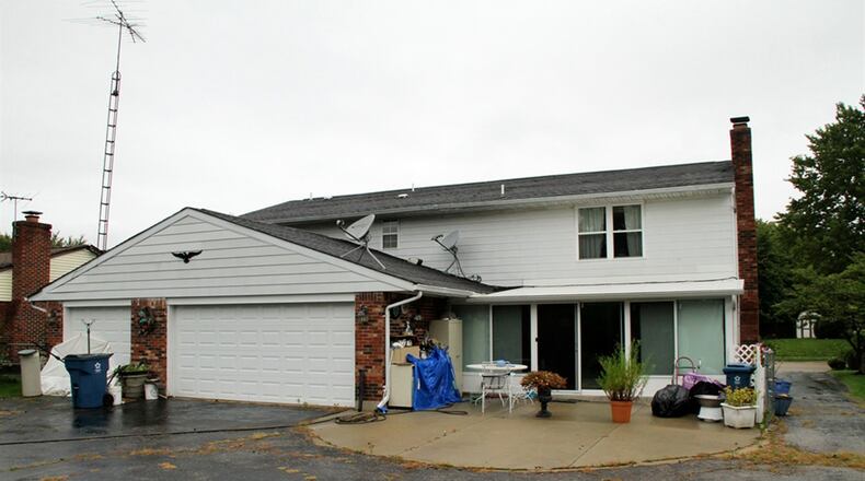 A Florida room adds to the living space of this 2-story home. The formal areas have a 2-story ceiling with balcony hallway. A 3-car garage has a rear entrance with extended paved driveway and concrete patio extension.