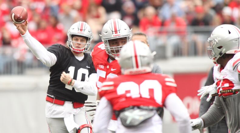 Ohio State's Joe Burrow throws a pass in the spring game on Saturday, April 14, 2018, at Ohio Stadium in Columbus.
