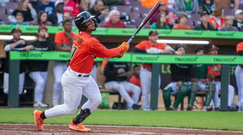 Dayton shortstop Leo Balcazar watches his fifth home run of the season head for the right-field lawn during Friday night's game at Day Air Ballpark. Jeff Gilbert/CONTRIBUTED