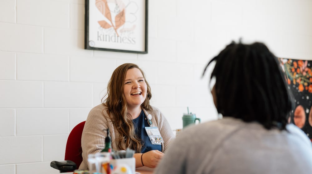 Dayton Children's Hospital student resiliency coordinator Sara Hooper works with a student. Courtesy of Dayton Children's.