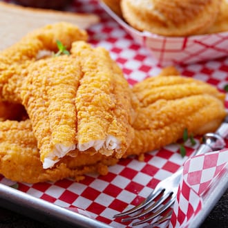 Shown in this photo to promote fish fry season is southern fried fish with toast, buttermilk breaded cod or catfish. ISTOCK