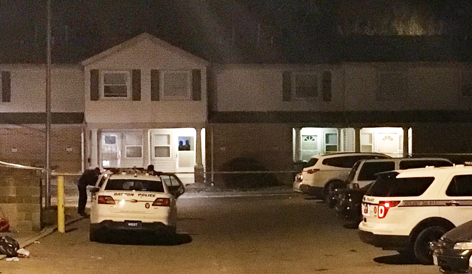 Dayton police investigate the apparent shooting death of 18-year-old Dontiaunna Brown at an apartment building on Caliph Court early Saturday morning. JEFFERY BROWN / STAFF