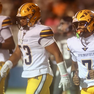 Springfield's Christopher Wallace returns to the bench after running for a touchdown in the first half against Fairmont on Friday, Oct. 17, 2025, at Roush Stadium in Kettering. David Jablonski/Staff