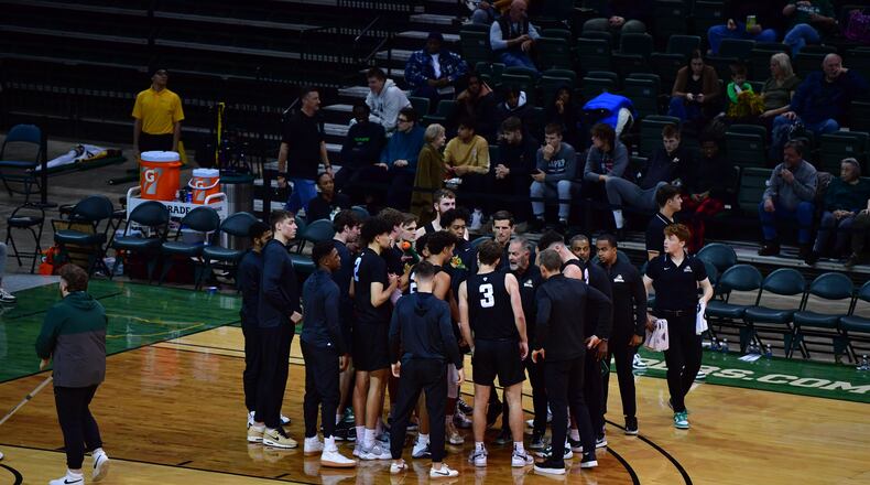 Wright State huddles around head coach Scott Nagy during a game vs. Western Kentucky at the Nutter Center earlier this season. Wright State Athletics photo
