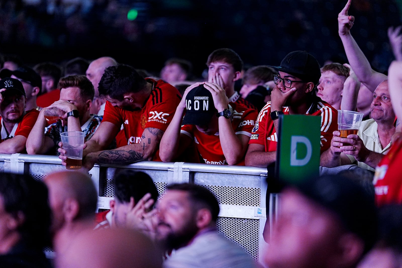 Manchester United fans react during a screening of the Europa League final soccer match between Manchester United and Tottenham Hotspur taking place in Bilbao, at the AO Arena, Manchester, England, Wednesday, May 21, 2025. (Peter Byrne/PA via AP)