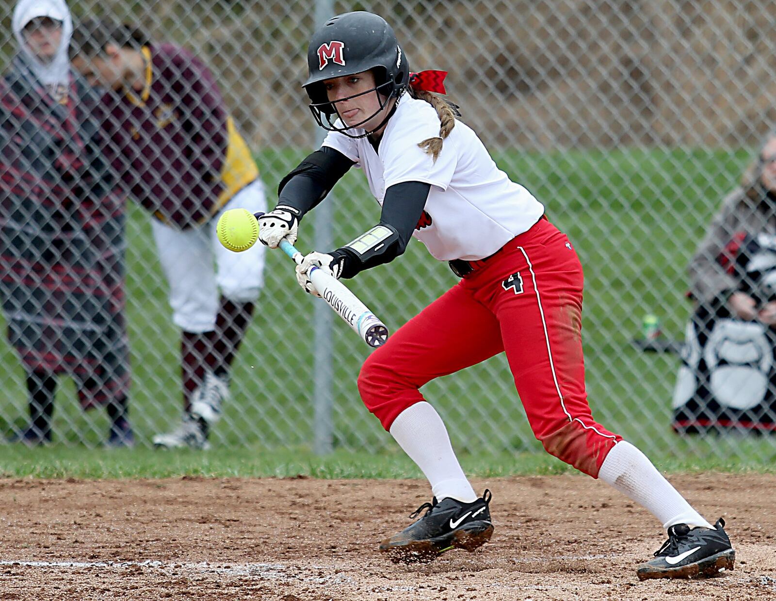 Madison’s Jenna O’Hair bunts for a single at Ross on Saturday. CONTRIBUTED PHOTO BY E.L. HUBBARD