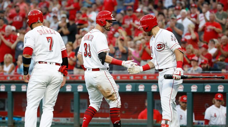 CINCINNATI, OH - JUNE 28: Jesse Winker #33 of the Cincinnati Reds celebrates with Adam Duvall #23 after hitting a home run in the third inning against the Milwaukee Brewers at Great American Ball Park on June 28, 2018 in Cincinnati, Ohio. (Photo by Andy Lyons/Getty Images)