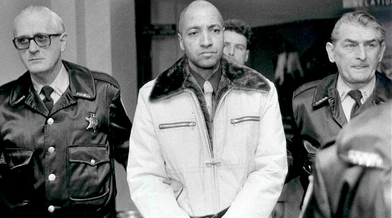 FILE - Convicted killer George Banks, center, is led through the Luzerne County, Pa. courthouse, on the way to his sentencing on Nov. 22, 1985. (Clark Van Orden/The Times Leader via AP, File)