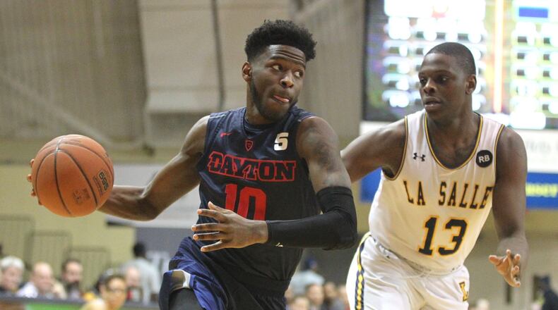 Dayton’s Jalen Crutcher drives to the basket against La Salle on Wednesday, Feb. 28, 2018, at Tom Gola Arena in Philadelphia. David Jablonski/Staff