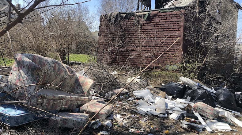 Dayton’s first citywide cleanup in a long time is Saturday. Volunteers hope to remove large volumes of trash from vacant properties and lots. CORNELIUS FROLIK / STAFF