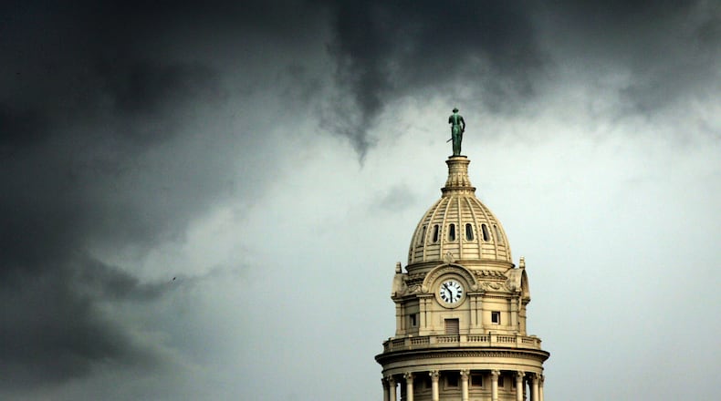 Clouds create a threatening weather backdrop  to the south of the Miami County courthouse Tuesday evening as severe thunderstorms  moved into the area. Photo by Jim Witmer