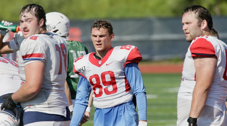 Dayton's Brian Dolby watches the action at practice on Wednesday, Aug. 17, 2022. David Jablonski/Staff