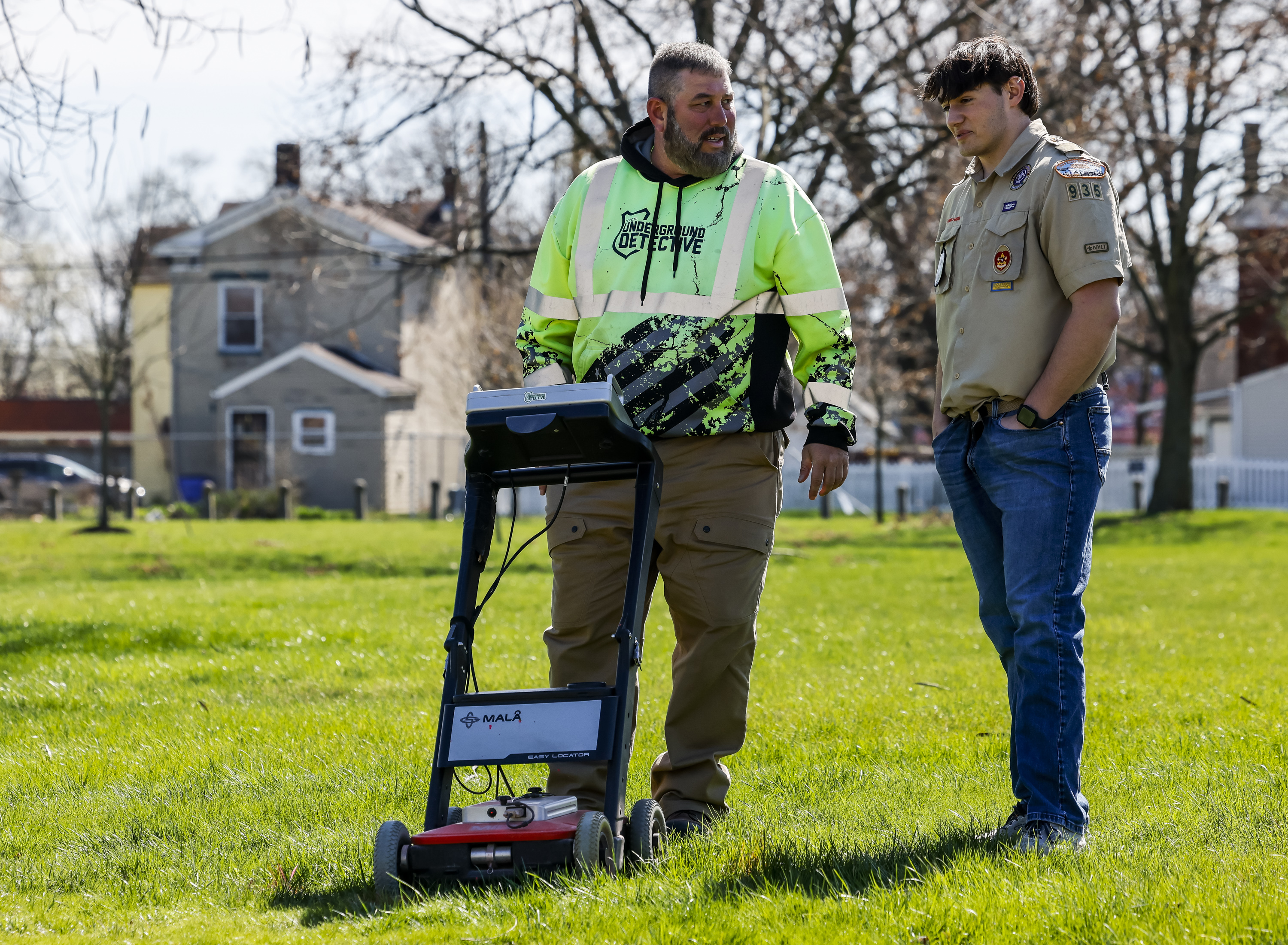 Carl Goyette, left, with The Underground Detective, uses ground penetrating radar at Symmes Park in Hamilton Wednesday, March 20, 2024 in Hamilton. Goyette is helping Eagle Scout candidate Zack Kramer locate the remains of Revolutionary War soldier, Private Paul Bonnel and his wife Mary Bonnel. NICK GRAHAM/STAFF