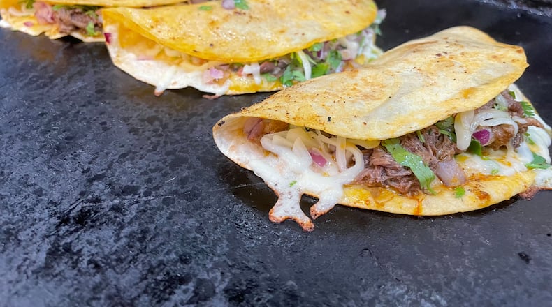 Taco Street Co., located in W. Social Tap & Table, offers beef, chicken, salmon or shrimp Birria tacos. NATALIE JONES/STAFF