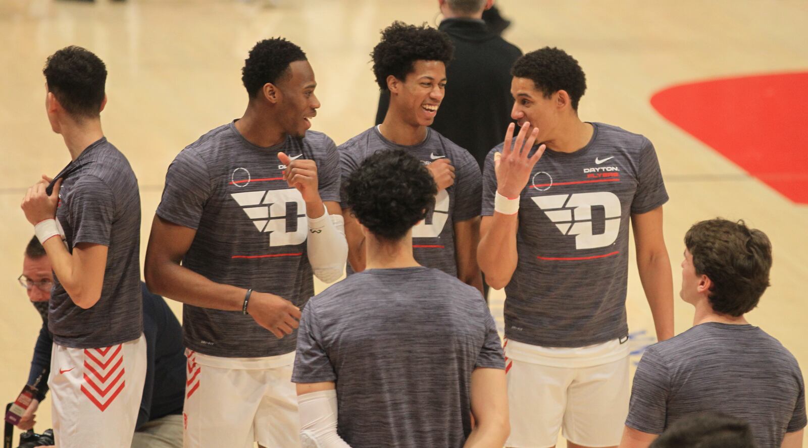 Dayton's Richard Amaefule, Kaleb Washington and Zimi Nwokeji share a laugh before a game against Fordham on Tuesday, Jan. 25, 2022, at UD Arena. David Jablonski/Staff