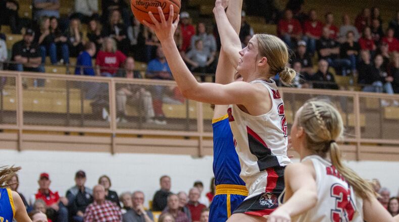 Fort Loramie's Victoria Mescher gets off a shot against Russia in Thursday's Division IV region semifinal at Butler High School. Jeff Gilbert/CONTRIBUTED