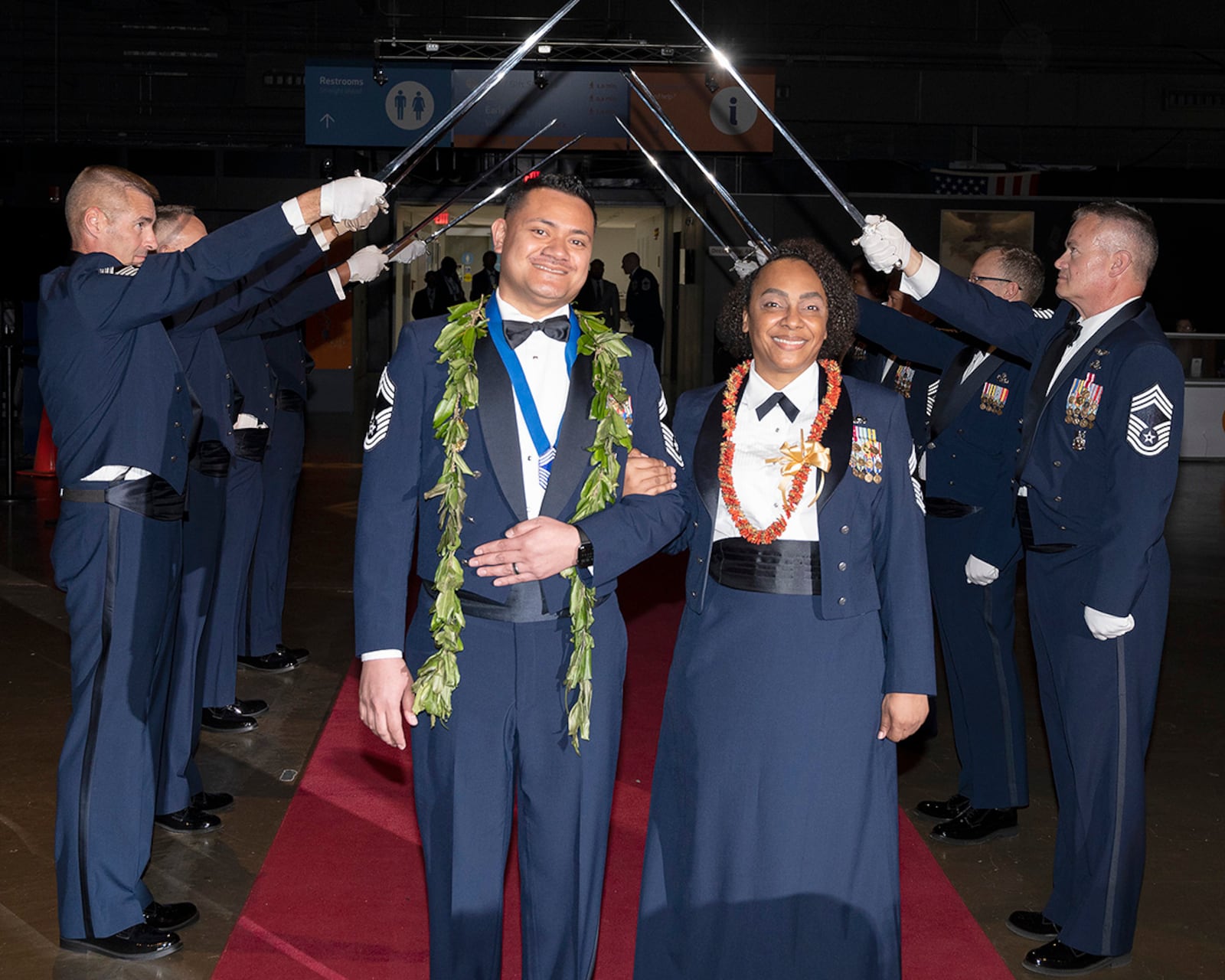Chief Master Sgt. Derek Maiava and his wife, Chief Master Sgt. Selena Maiava, pause after passing the saber cordon May 14 as they enter the Wright-Patterson Chief Master Sergeant Recognition Ceremony at the National Museum of the U.S. Air Force. Derek Maiava was honored as one of the Wright-Patterson Airmen recently selected for promotion to the Air Force’s highest enlisted rank. U.S. AIR FORCE PHOTO/R.J. ORIEZ