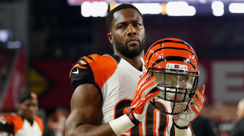 Bengals defensive end Michael Johnson celebrates Father's Day year-round, and often on the family farm near Selma, Ala., with Samuel Johnson.