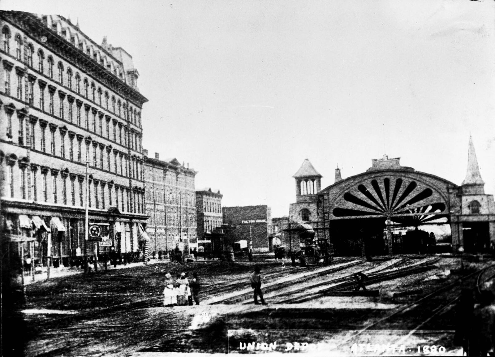 Circa 1880: Union Station, with its distinctive fan-shaped center arch, is seen next to the original Kimball House at left. (Tracy O'Neal Collection at GSU Library N02-21_01)
