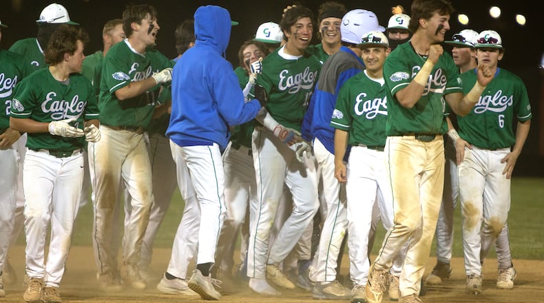Chaminade Julienne celebrates Christian Gongora (middle) and his walkoff single that lifted the Eagles to a 1-0 victory over Indian Hill in Thursday night's district final at Cincinnati Princeton. Jeff Gilbert/CONTRIBUTED