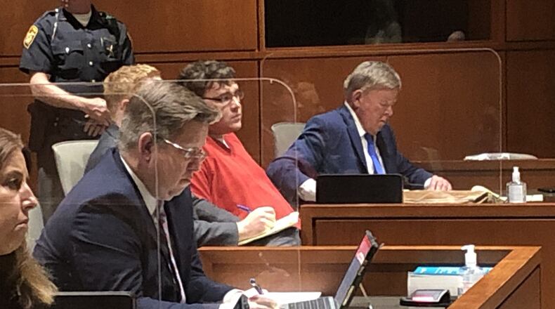 John Austin Hopkins, 26, of Springboro listens as he is sentenced to 8 years in prison on 34 counts of gross sexual imposition on 1st grade girls in his gym class at Clearcreek Elementary School LAWRENCE BUDD/STAFF