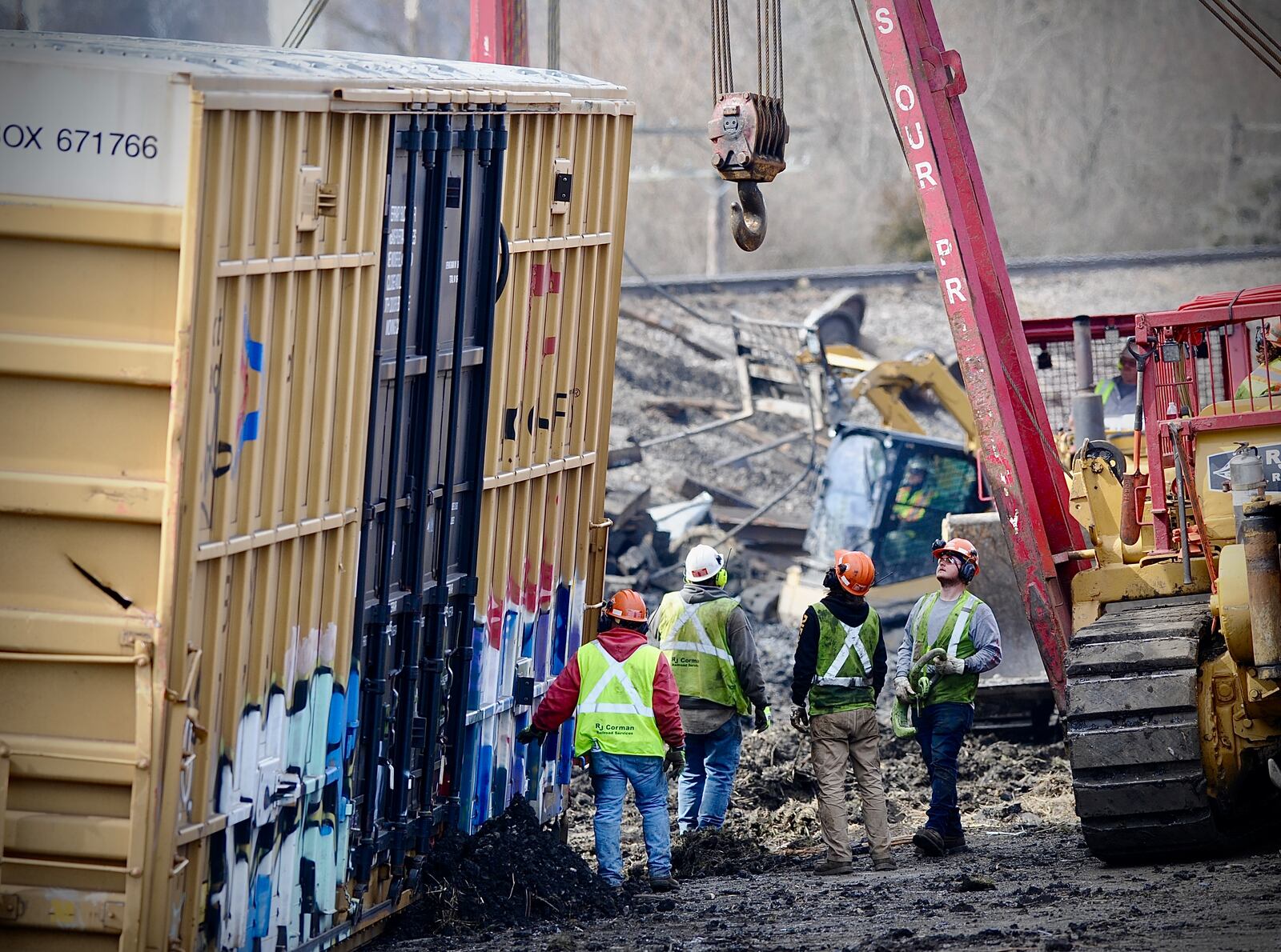 Cleanup crews work to remove the rail cars from a Norfolk Southern train derailment along Ohio 41 near the Clark county fairgrounds Sunday morning March 5, 2023. MARSHALL GORBY \STAFF