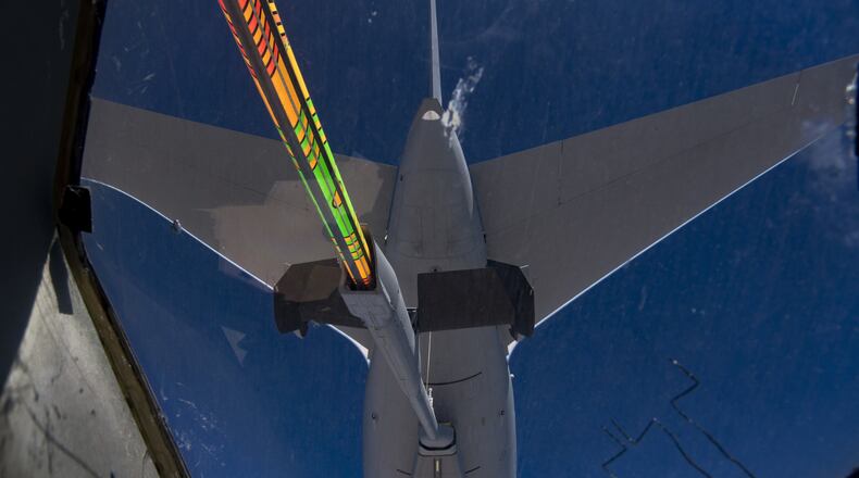 A 22nd Air Refueling Wing KC-46A Pegasus refuels a C-17 Globemaster III from Joint Base Lewis McChord, Alaska s 62nd Airlift Wing over the Arabian Gulf, Nov. 23, 2019. The flight, which offered familiarization with the KC-46A for Qatar Emiri Air Force leadership and personnel, marked the first Pegasus refueling mission in the U.S. Central Command area of operations. (U.S. Air Force photo by Staff Sgt. Daniel Snider)