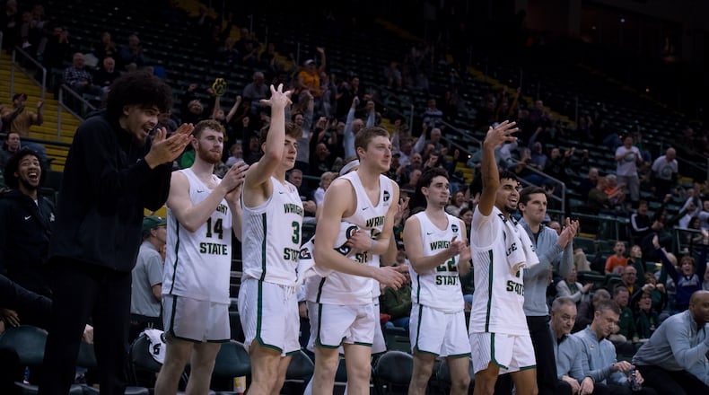 Wright State's Drey Carter (far left) cheers on his teammates during a game vs. IUPUI last season at the Nutter Center. Wright State Athletics photo
