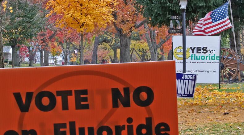 Signs along North Fountain Avenue for and against flouride in the water in Springfield. BILL LACKEY/STAFF