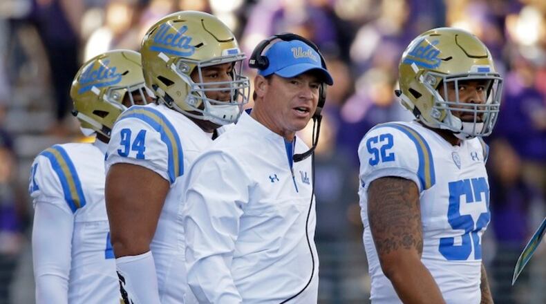 UCLA head coach Jim Mora looks toward the field against Washington in the first half of an NCAA college football game Saturday, Oct. 28, 2017, in Seattle. (AP Photo/Elaine Thompson)
