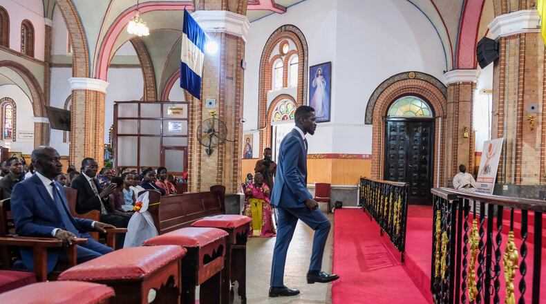 Uganda's leading opposition presidential candidate, Bobi Wine, attends a church service at the Rubaga Cathedral in Kampala, Uganda, Thursday, Jan. 1, 2026. (AP Photo/Hajarah Nalwadda)