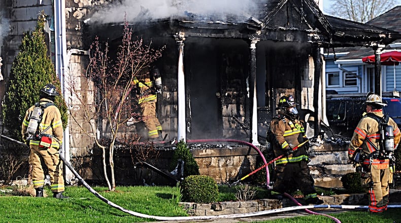 Fire erupts at Tipp City house - Marshall Gorby/STAFF