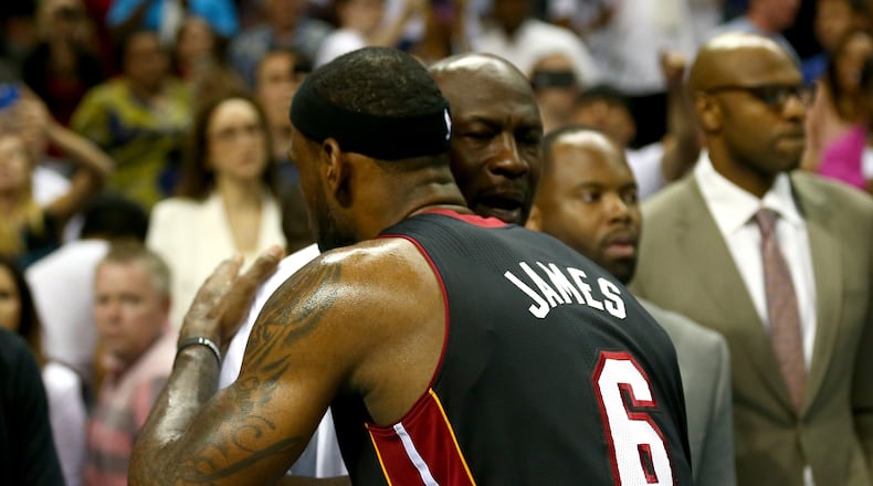 CHARLOTTE, NC - APRIL 28: LeBron James #6 of the Miami Heat hugs Michael Jordan after defeating the Charlotte Bobcats 109-98 in Game Four of the Eastern Conference Quarterfinals during the 2014 NBA Playoffs at Time Warner Cable Arena on April 28, 2014 in Charlotte, North Carolina. NOTE TO USER: User expressly acknowledges and agrees that, by downloading and or using this photograph, User is consenting to the terms and conditions of the Getty Images License Agreement. (Photo by Streeter Lecka/Getty Images)