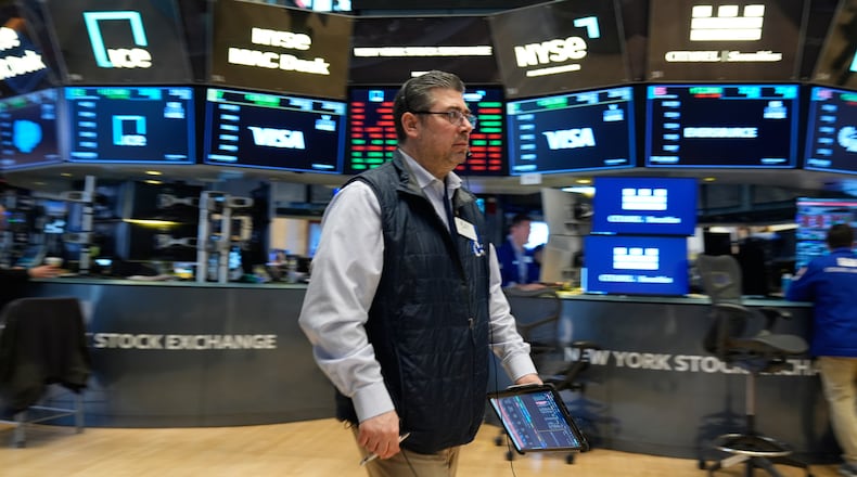 Michael Capolino works on the floor at the New York Stock Exchange in New York, Thursday, March 19, 2026. (AP Photo/Seth Wenig)