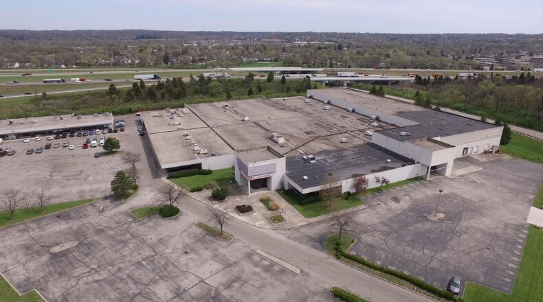 The city of West Carrollton plans to extend leases through the end of the year for two tenants at the Carrollton Plaza along I-75. The city plans to demolish buildings there next year and redevelop the site as part of a multi-million dollar entertainment district. TY GREENLEES / STAFF