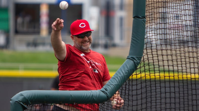 Reds minor-league hitting coordinator Dave Hansen throws batting practice for the Dragons at Dayair Ballpark on Thursday. Hansen is incorporating new technology into his coaching. CONTRiBUTED/Jeff Gilbert