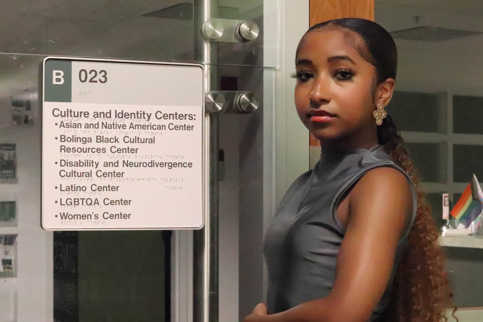 Charisse Bush, Wright State University student and president of the college's Association of Black Business Students, standing outside the office space of five Culture and Identity Centers that were discontinued on June 27 due to Senate Bill 1. DION JOHNSON/STAFF