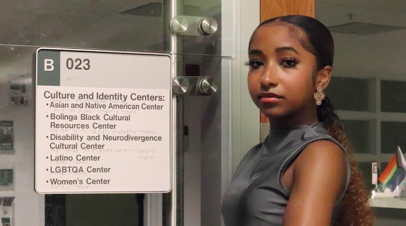Charisse Bush, Wright State University student and president of the college's Association of Black Business Students, standing outside the office space of five Culture and Identity Centers that were discontinued on June 27 due to Senate Bill 1. DION JOHNSON/STAFF
