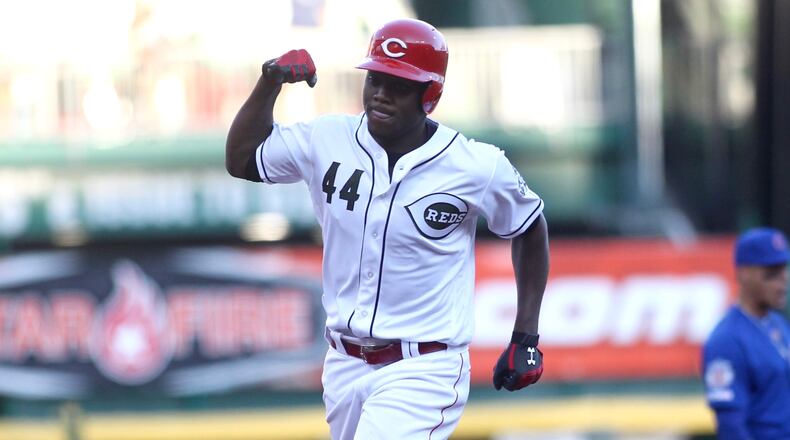 The Reds’ Aristides Aquino rounds the bases after a two-run home run in the second inning against the Cubs on Friday, Aug. 9, 2019, at Great American Ball Park in Cincinnati. David Jablonski/Staff