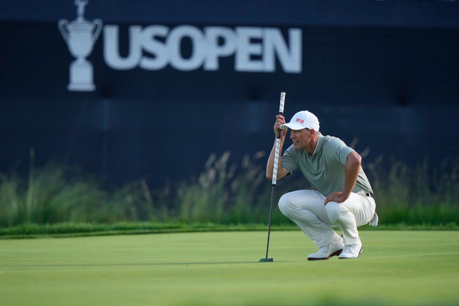 Adam Scott, of Australia, lines up a putt on the 13th hole during the third round of the U.S. Open golf tournament at Oakmont Country Club Saturday, June 14, 2025, in Oakmont, Pa. (AP Photo/Charlie Riedel)