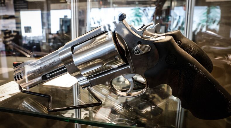 A handgun on display at a local store in Dayton. JIM NOELKER/STAFF