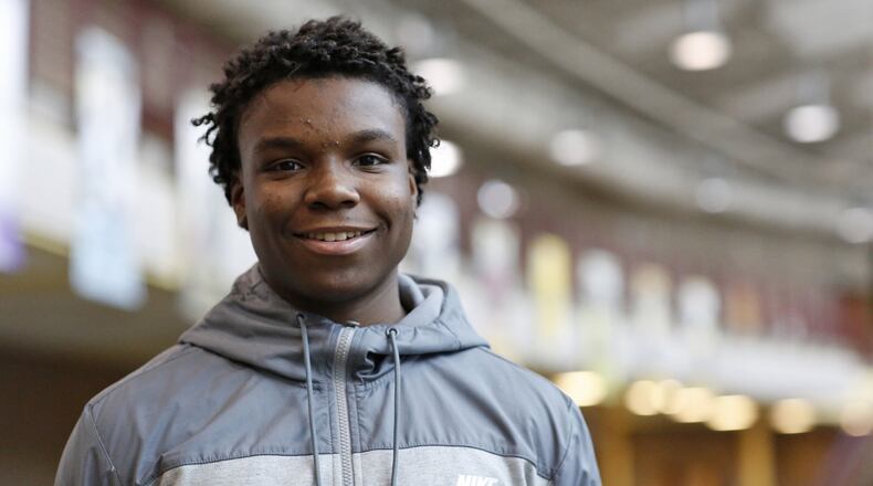 Ponitz High School football quarterback Xavier Henry carries a 3.7 GPA at Dayton Early College Academy. Henry is being honored at the National Football Foundation “That’s My Boy” Awards Dinner. TY GREENLEES / STAFF