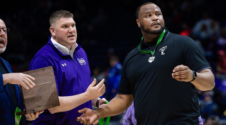 Middletown athletic director JD Foust (left) is with Middies boys basketball coach Bill Edwards Jr. during last year's tournament. Foust was announced as Sidney's next athletic director. Kyle Hendrix/CONTRIBUTED PHOTO