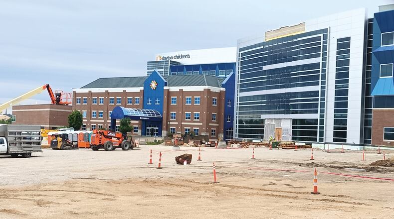 Pictured is the ongoing construction outside of Dayton Children’s Hospital on Tuesday, July 26, 2022, which includes work being done for the five-story specialty care outpatient center projected to open in 2023. SAMANTHA WILDOW\STAFF